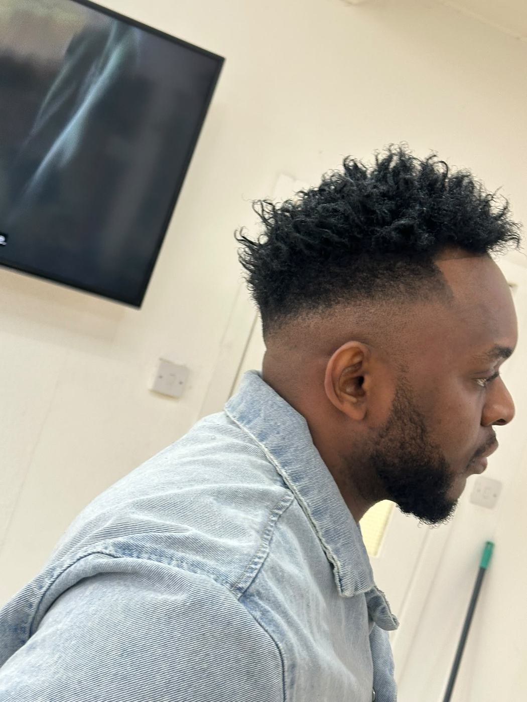 Long dreadlocks styled with a sharp fade