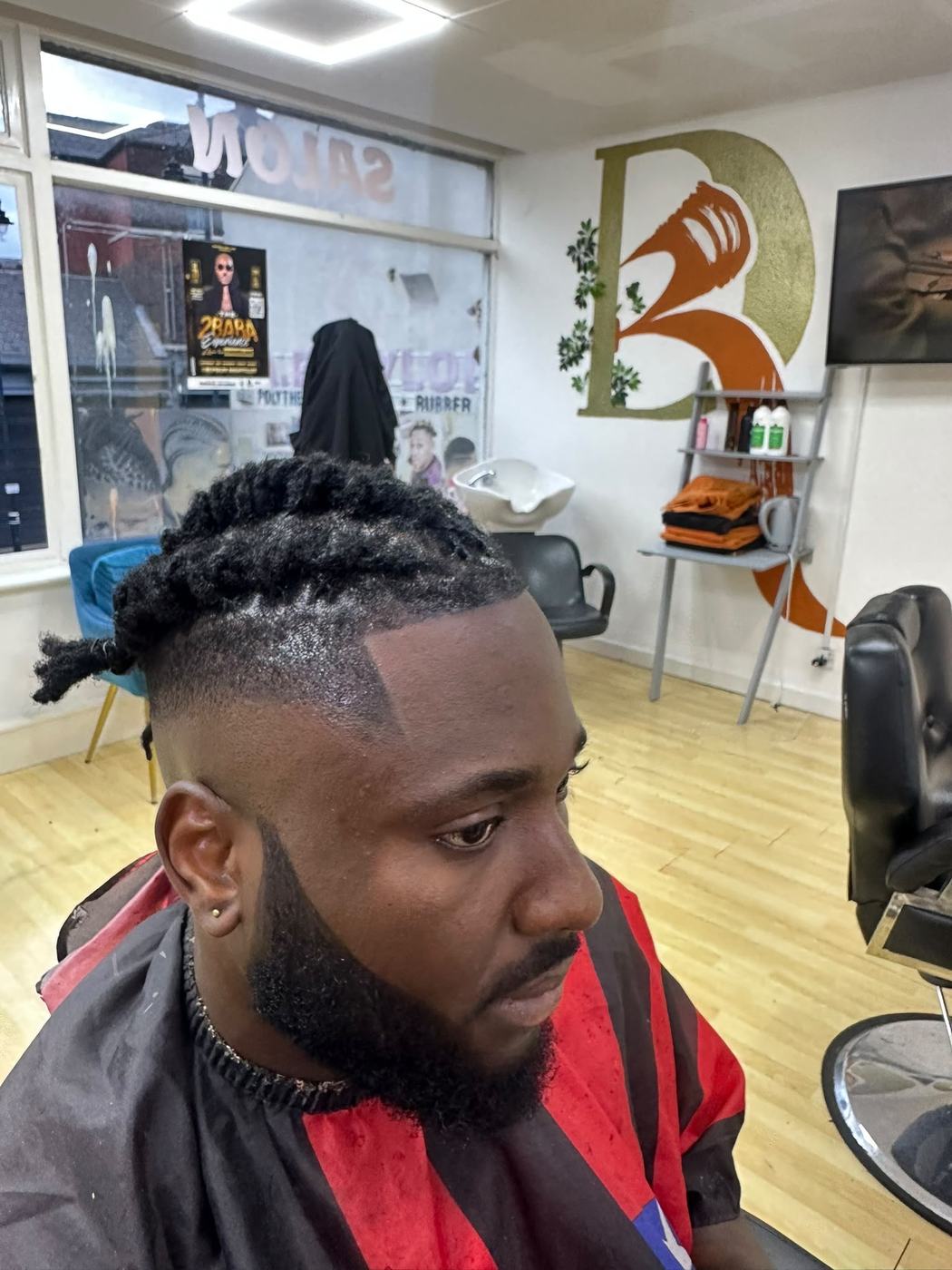 Low skin fade with curly top
